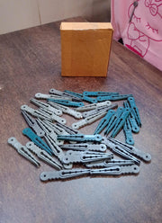 An image illustrating the compact size and easy storage of the 36 Pcs plastic cloth pegs.