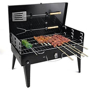Compact charcoal grill set up for an outdoor picnic, perfect for small gatherings.