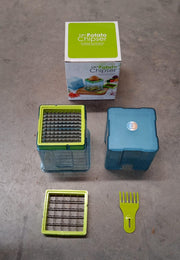 Lifestyle shot of a kitchen counter with fresh potatoes and the potato chipper ready for use.