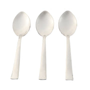 Three stainless steel dining spoons arranged side by side for tableware
