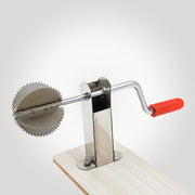 Close-up view of the Quickslice stainless steel coconut scraper's grating surface.