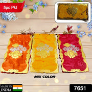 Close-up of glossy, premium shagun envelopes for gifting cash.