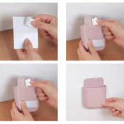 A smartphone securely held in a wall mounted phone holder with a charging cable neatly routed.