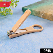 Close view of ergonomic ring-handle nail clipper showing anti-slip textured lever