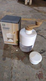 Small ice crusher featuring durable stainless steel blades for homemade shaved ice.