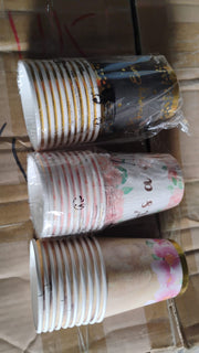 Variety of disposable paper cups for hot and cold drinks.