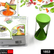 Handheld vegetable spiralizer creating long, thin strands of zucchini for a healthy meal