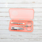 AuriGlam portable nail clipper set in its clear plastic travel case.