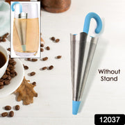 A cute umbrella tea strainer steeping loose leaf tea in a clear mug.