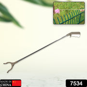 Ergonomic garbage picker tool with a comfortable grip for kitchen waste cleanup.
