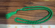 Textural close-up of Muslim prayer beads, highlighting the acrylic material.