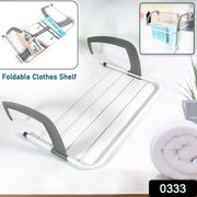 Compact folding drying rack securely attached to a balcony railing, ideal for outdoor use.