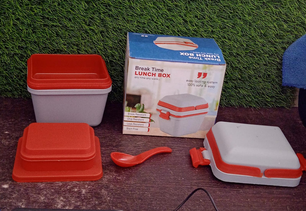 Empty sturdy lunch box with a clear lid, showcasing its airtight seal and handle.