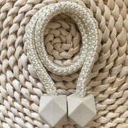 A pair of non-magnetic pearl curtain tiebacks displayed against a plain background.
