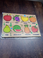 Lifestyle shot showing the wooden fruit puzzle in a child's play area.