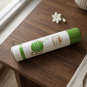 User spraying premium air freshener into indoor room for freshness