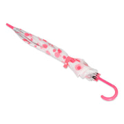 A neatly folded white umbrella with pink polka dots and a pink curved handle is secured with a pink strap.
