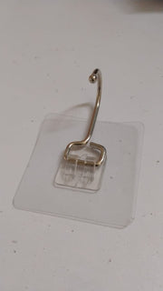 SteadyClear transparent adhesive wall hook holding towels and keys