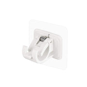 Wall-mounted adhesive towel holder showing towel rod and hooks