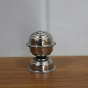 Agarbatti burning in a Lotus incense holder, creating a serene ambiance.