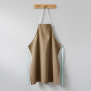 Chef apron shown alongside cooking utensils