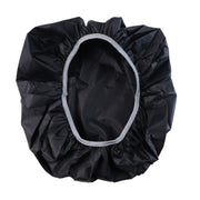 A black rain cover with a light gray elastic rim is spread open, showing its interior.