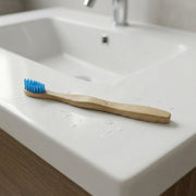 Angled view of sustainable wooden toothbrush