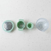 Top-down view showing various grating surfaces on manual vegetable grater