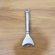 Vegetable skin remover tool with ergonomic handle and sharp blade