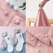 Close-up view of Soft Duvet Button Clip showing locking mechanism