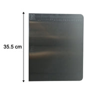Measurement scale on stainless steel chopping board showing size
