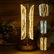 Sleek cylinder crystal table lamp on metallic base providing ambient lighting