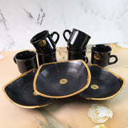 Overhead view of the complete seashell ceramic cup and bowl set.