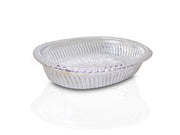 Close-up of a decorative oval silver tray with intricate royal patterns.