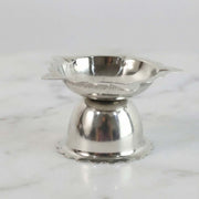 Compact decorative steel diya stand with sunflower design for rituals