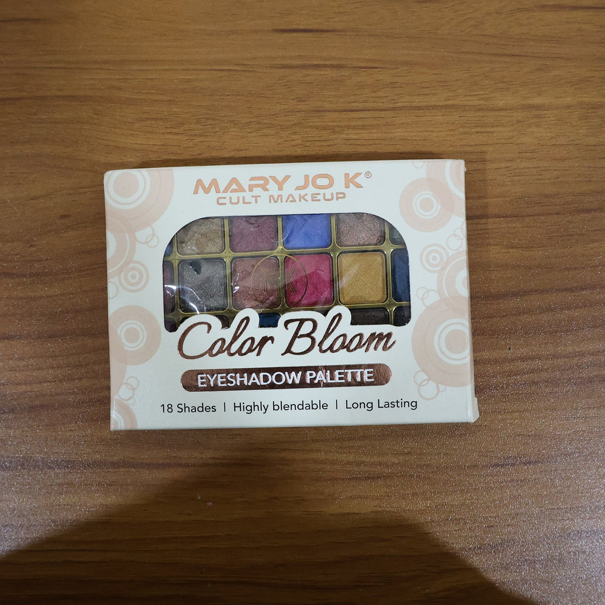 Model showcasing eye makeup created using 18-color shimmer eyeshadow palette