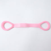 Woman using resistance band for arm exercises during workout