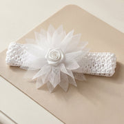 Close-up of floral bow on the soft stretchable baby headband