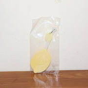 Lemon-shaped hand fan providing instant manual cooling and comfort