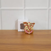 Festival gift Ganesha murti with golden decorative appearance