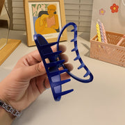 Hair clip holding hair back during face washing, plastic matte claw clip