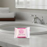 Close-up image showing shampoo sachet and bath soap in the toiletry kit
