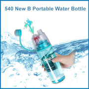 Person using the integrated face mist sprayer on the portable water bottle for quick refreshment.