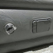 Portable inflatable bed partially folded illustrating compact and lightweight design