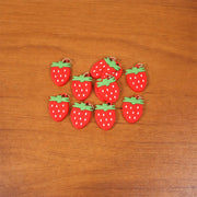 Colorful set of strawberry-themed keychain accessories