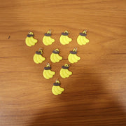 Assorted banana-shaped bag charms in set