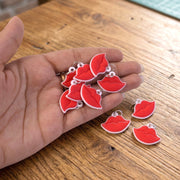 Set of fashionable lips bag charms and keyrings displayed together