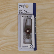 Compact metal key holder featuring locking carabiner clip in outdoor setting