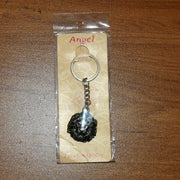 Lion head keychain attached to a set of keys demonstrating practical use