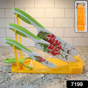 Side view of the plastic knife stand holding various kitchen knives, demonstrating its storage capacity.